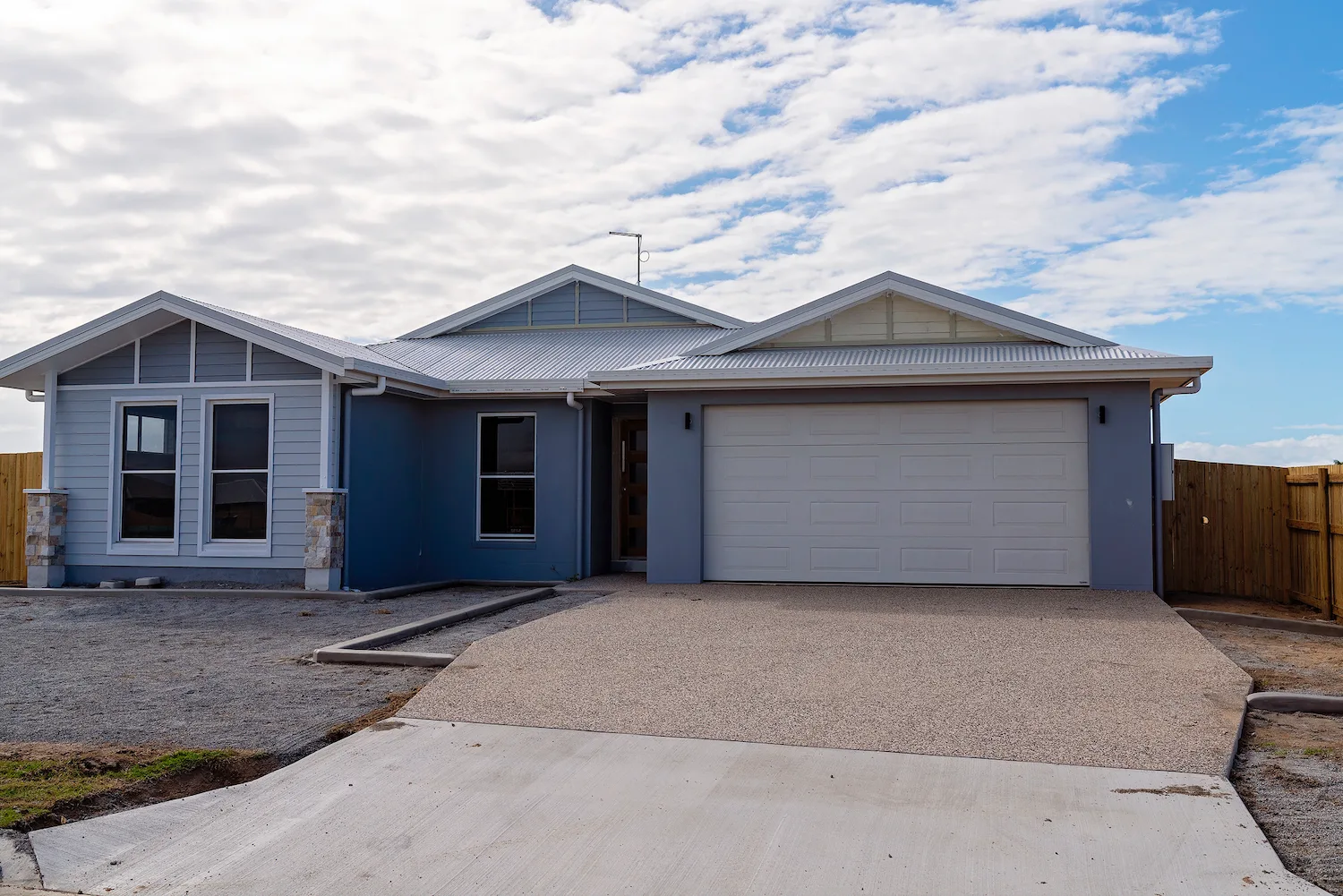 Concrete driveway crossover finished from garage to street