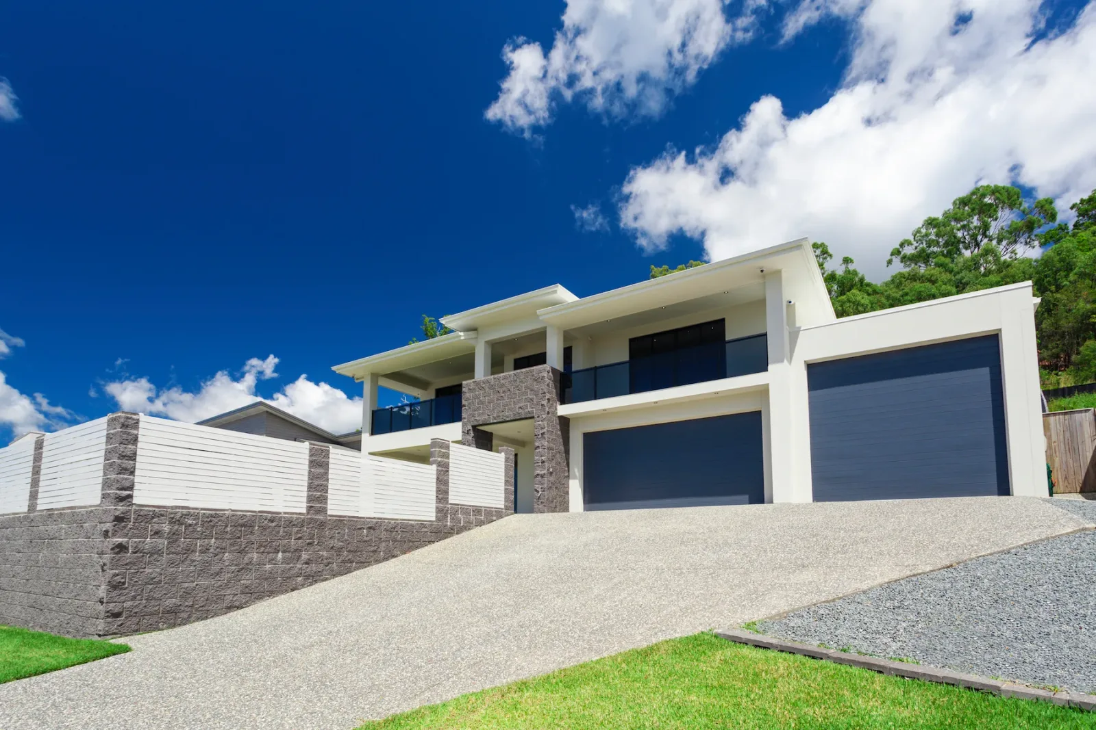 New concrete driveway poured on a sloped Red Hill block