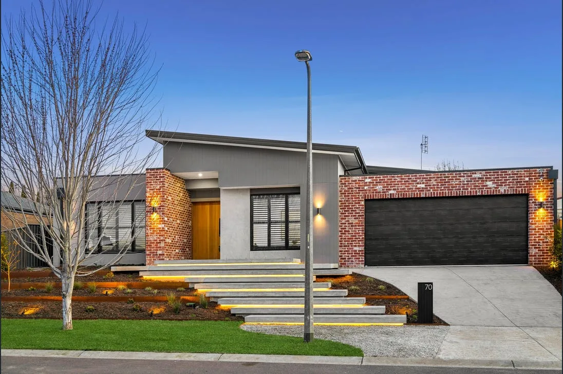 Concrete driveway with feature entry pillars finished for a Portsea property
