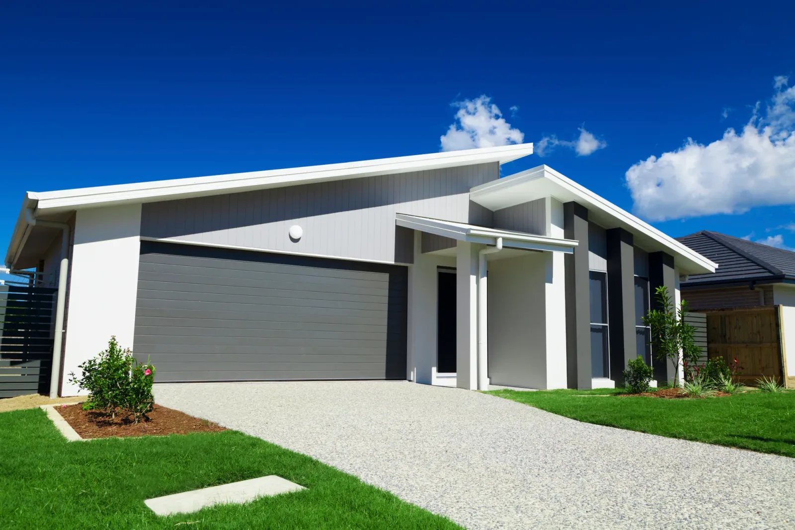 Concrete driveway poured on a sloped block for a modern home