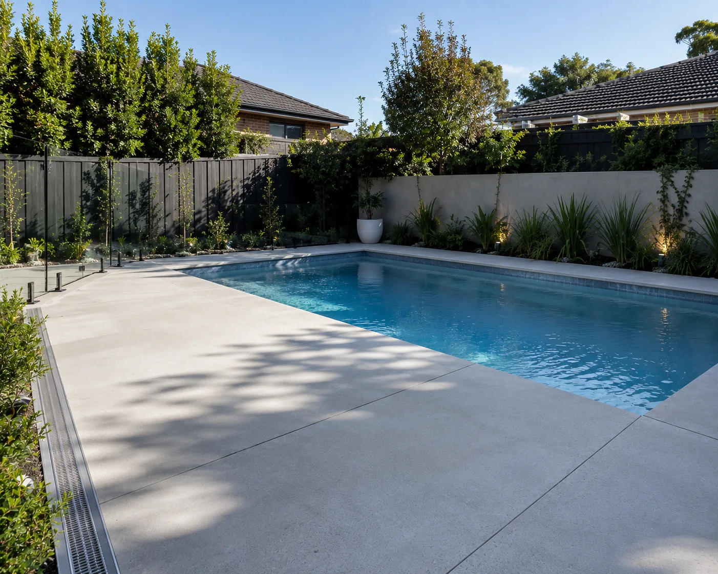 Concrete pool surround finished beside a covered alfresco area