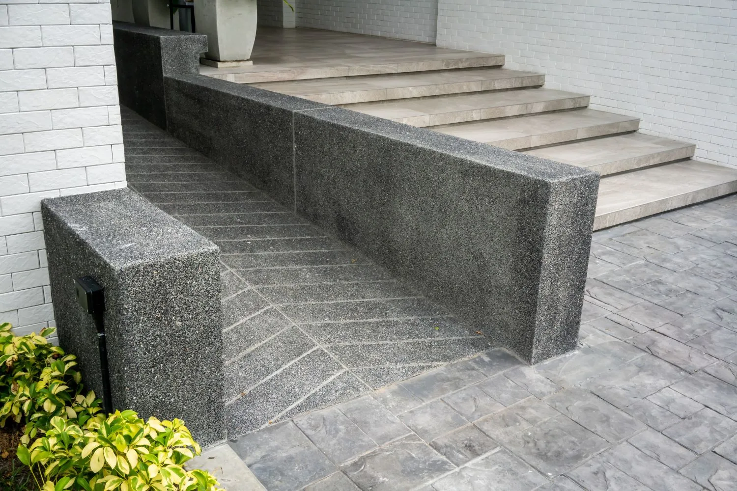 Concrete ramp finished alongside garden steps