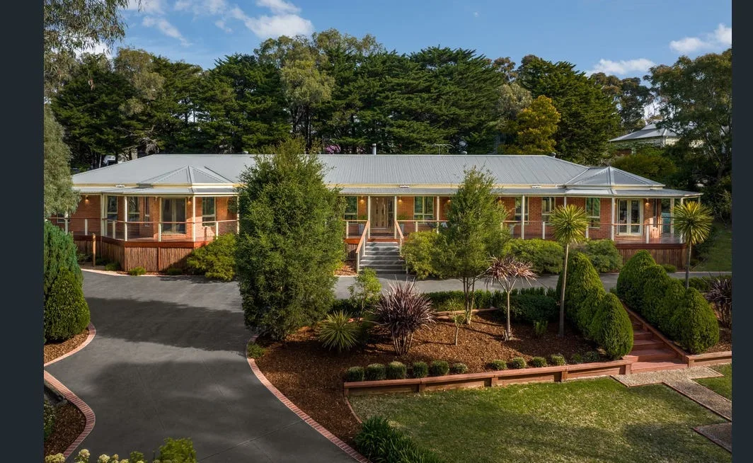 Aerial view of a circular concrete driveway on a leafy Mt Eliza block
