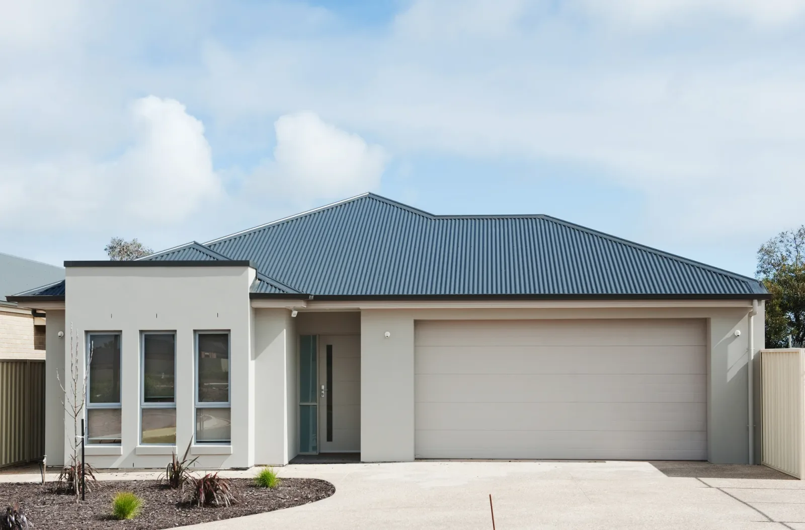 Plain finish concrete driveway for a family home